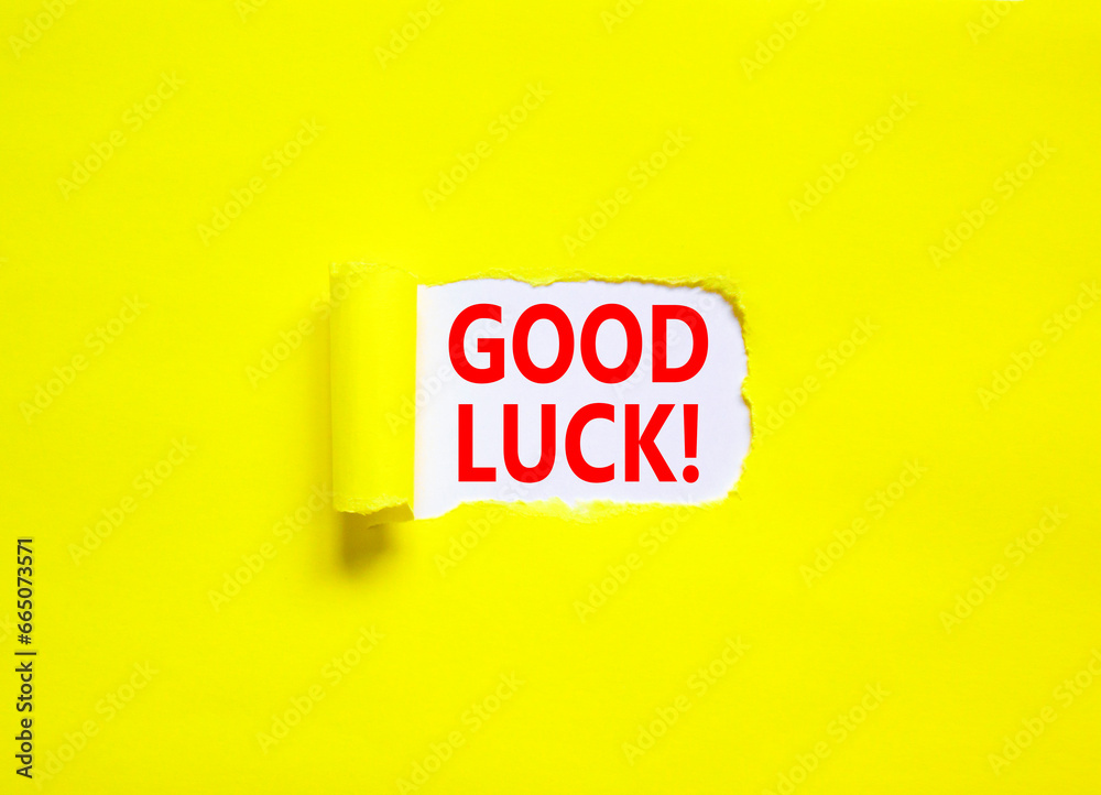 Good luck symbol. Concept words Good luck on beautiful white paper. Beautiful yellow paper background. Business, motivational good luck concept. Copy space. Good luck symbol. Concept words Good luck on beautiful white paper. Beautiful yellow paper background. Business, motivational good luck concept. Copy space.