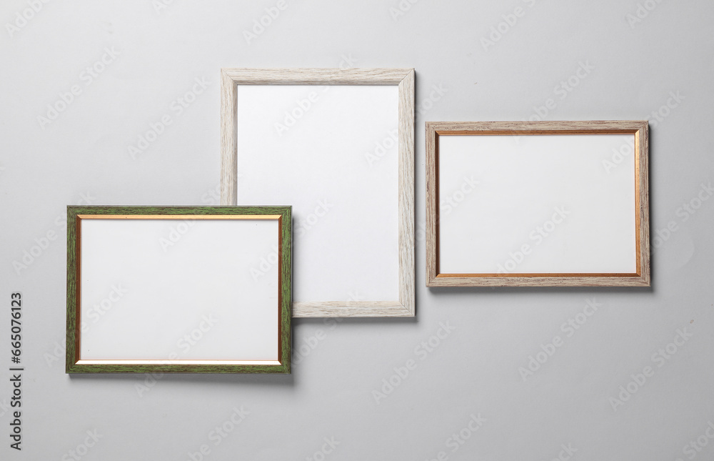 Blank wall frames on a gray background