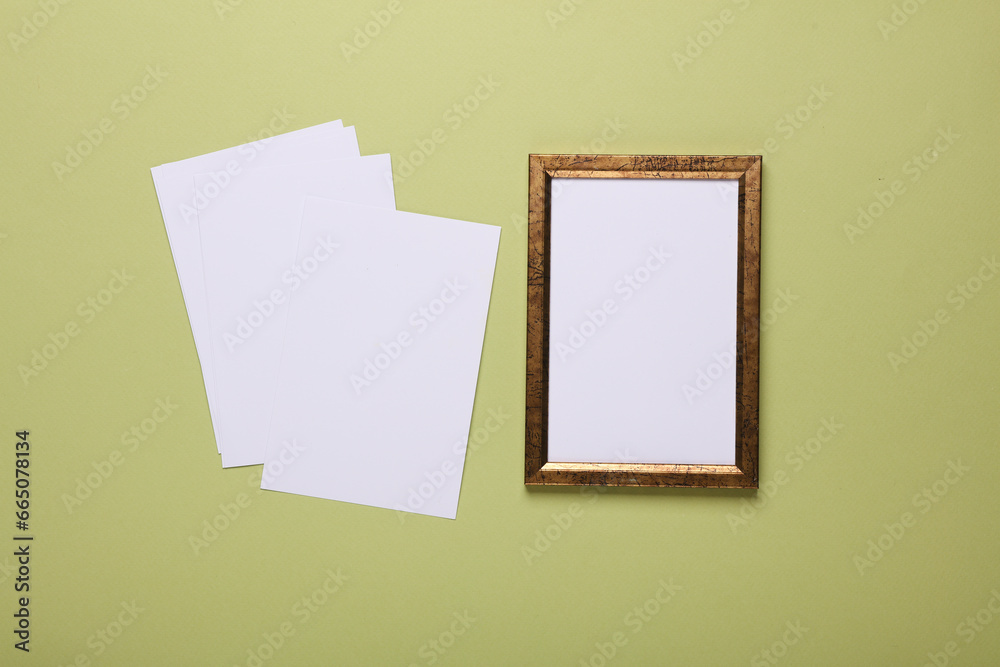 Frame with empty white photos mockup on green background Frame with empty white photos mockup on green background