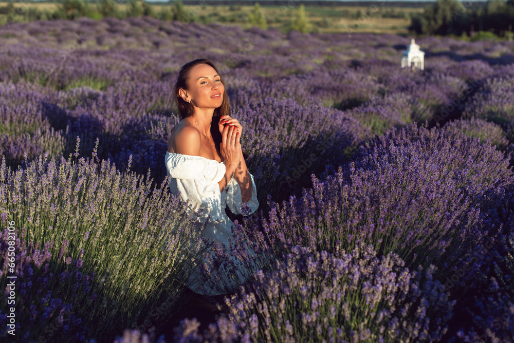 Summer sunny evening with a young woman