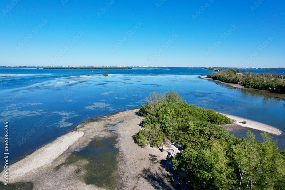 Fototapeta premium An aerial photo of coastline near Skyway Bridge, St. Petersburg, Florida, by drone pilot Anita Denunzio.