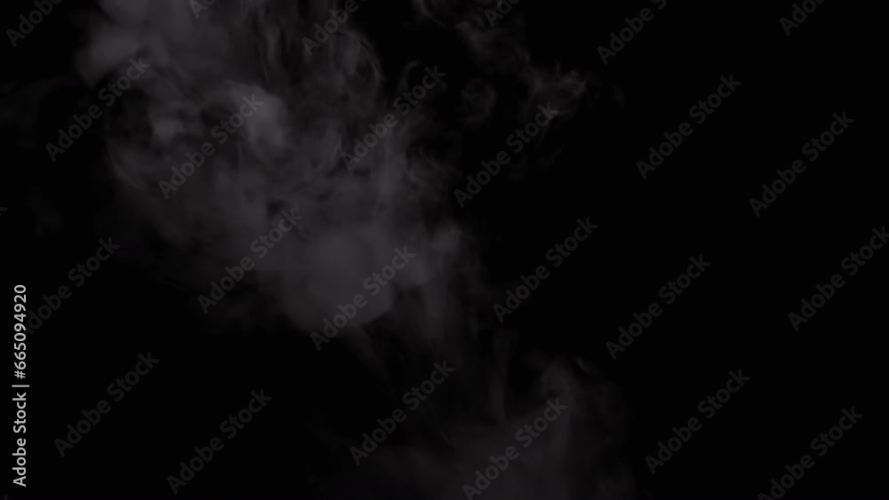 Flying Clouds of Thick Gray Smoke on an Isolated Black Background. Puffs of icy clouds of smoke or steam dissolve into space in a blurry motion. Floating fog. Blowing, fall. Bokeh. Abstract, texture. Flying Clouds of Thick Gray Smoke on an Isolated Black Background. Puffs of icy clouds of smoke or steam dissolve into space in a blurry motion. Floating fog. Blowing, fall. Bokeh. Abstract, texture.