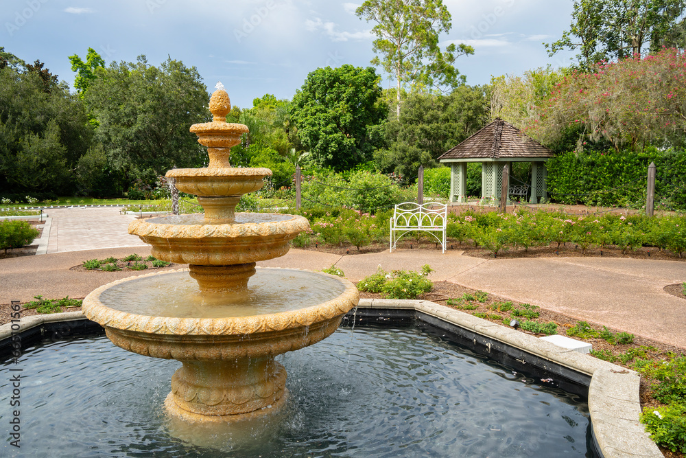 A Garden with a Fountain, a Bench and a Gazebo. A Garden with a Fountain, a Bench and a Gazebo.