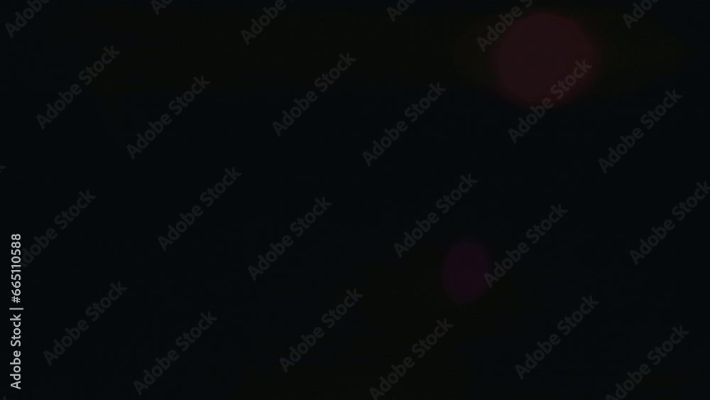 Abstract overlay with light transition, colorful geometric lens flare flashes effects on dark background. Anamorphic lens flares. Abstract overlay with light transition, colorful geometric lens flare flashes effects on dark background. Anamorphic lens flares.