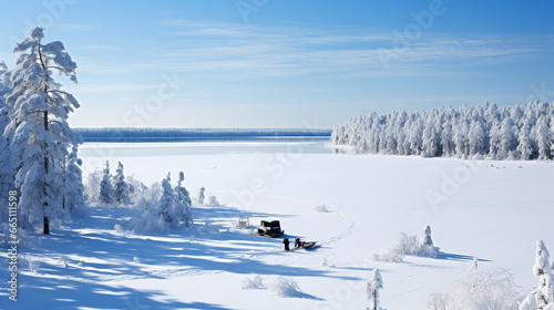 A scenic vista of an ice-covered lake surrounded by snow-draped trees, where anglers dot the horizon, illustrating the beauty and solitude of winter fishing © Наталья Евтехова