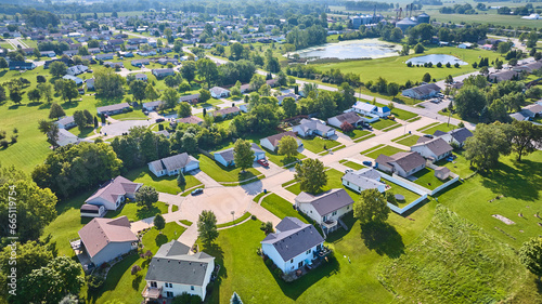 Photos Aerial generic neighborhood with houses around different culdesacs and distant p