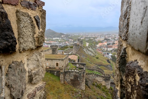 Watchtowers and a fragment of the Southern wall of Akhaltsikhe (Rabati) Castle viewed through battlements of the Castle of Mario, Georgia