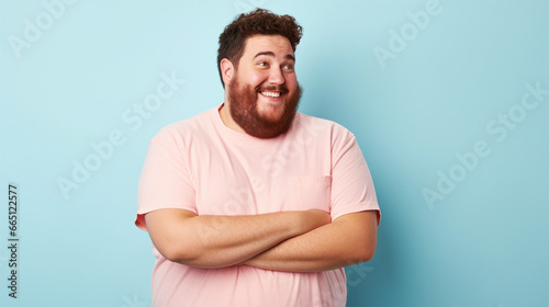Happy bearded plus size man on blue background .