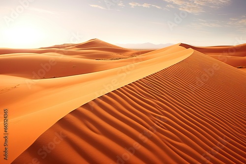 Rolling orange sand dunes and sand ripples. © Emran