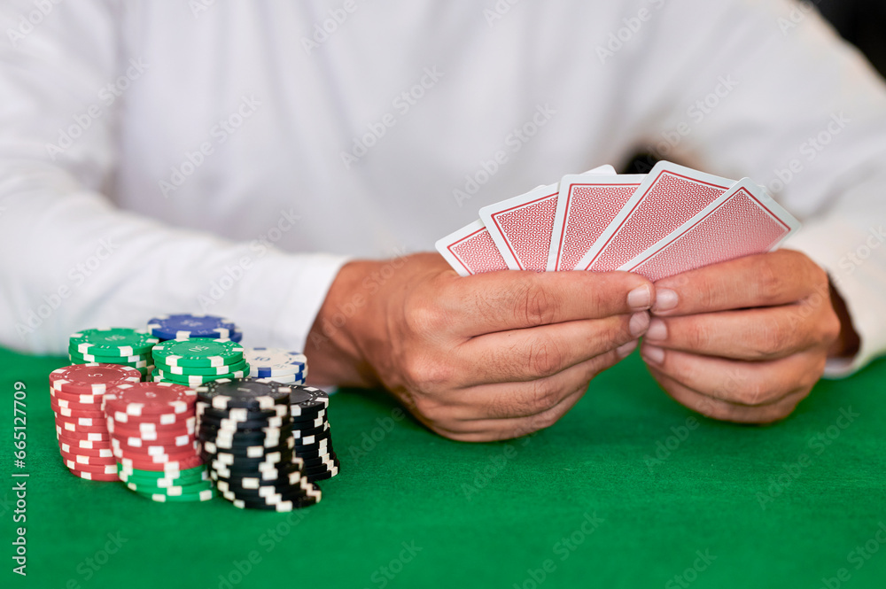 Man with casino cards and betting chips Man with casino cards and betting chips