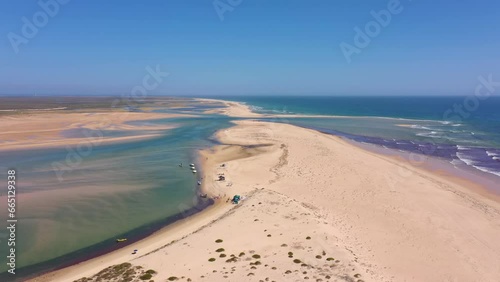 Aerial video filming by drone of the marine reserve Ria Formosa Faro Portugal Algarve. Praia de Barinha. Flight moving forward on the duct. photo