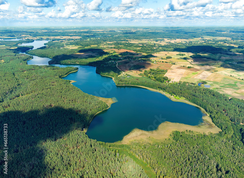 Aerial view of a lake in the forests of Lithuania, wild nature. The name of the lake is "Ilgis", Varena district, Europe.