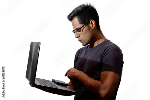 Young Latino with glasses and laptop, about to press a key, networking concept, programming, cybersecurity. Isolated.
