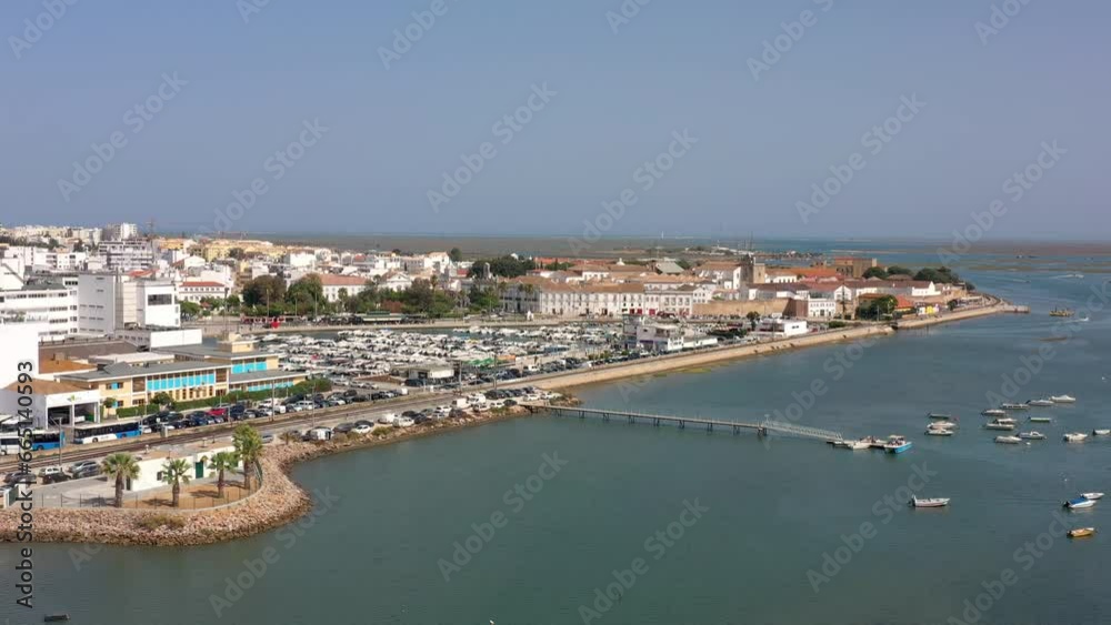 Aerial drone video of the harbor for boats in the marina of the city of Faro. Distant view from the Ria Formosa river. Portugal Algarve. Aerial drone video of the harbor for boats in the marina of the city of Faro. Distant view from the Ria Formosa river. Portugal Algarve.