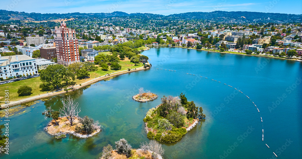 Pelican Island on Lake Merritt with aerial of Oakland City residential area