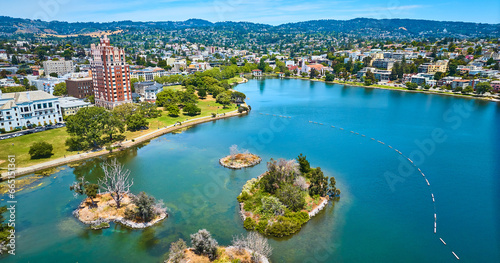 Pelican Island on Lake Merritt with aerial of Oakland City residential area