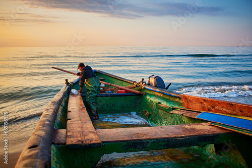 sunrise with a fishing boat on the Black Sea