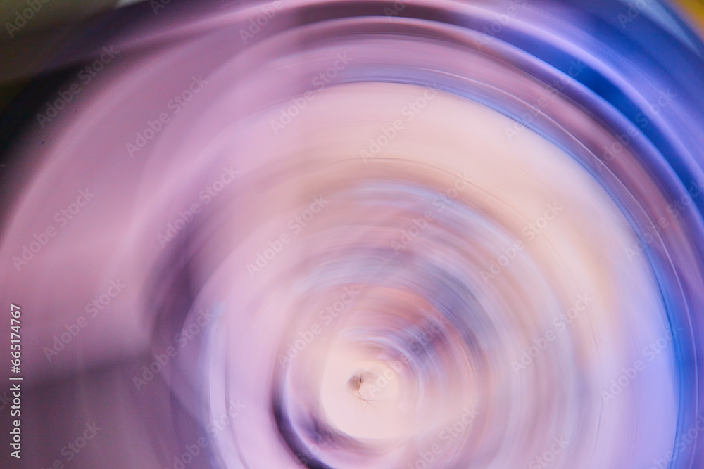 Smoky purple artistic blur with outer dark blue rim of ripple drop in abstract art