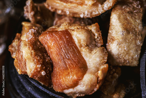 Brazilian crackling, an appetizer made by frying bacon, a layer of leather, meat and lots of fat, usually taken from the pork belly photo