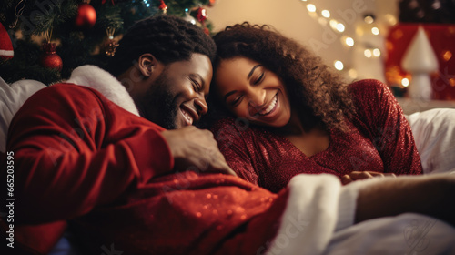 Happy couple in christmas night at home.