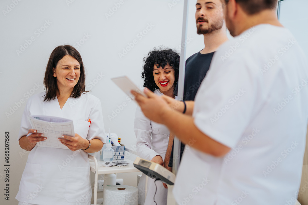 Healthcare Professionals Conduct Medical Examinations in an Indoor Hospital Room Healthcare Professionals Conduct Medical Examinations in an Indoor Hospital Room