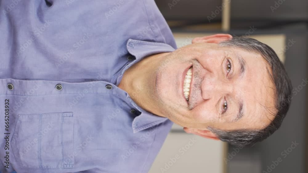 Vertical video of Happy old man smiles at the camera. Vertical video of Happy old man smiles at the camera.