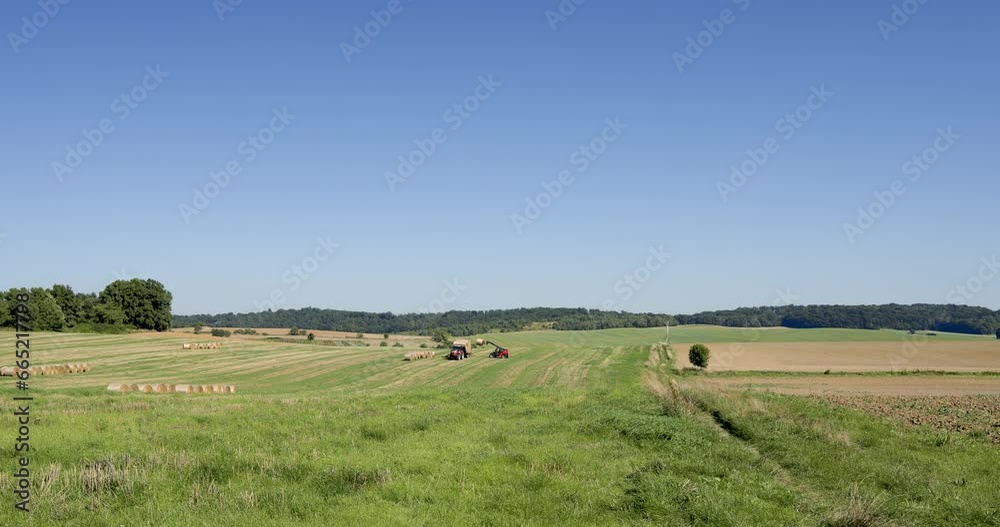 Agricultural work on a summer day, tractor, harvesting hay bales, part 3 Agricultural work on a summer day, tractor, harvesting hay bales, part 3