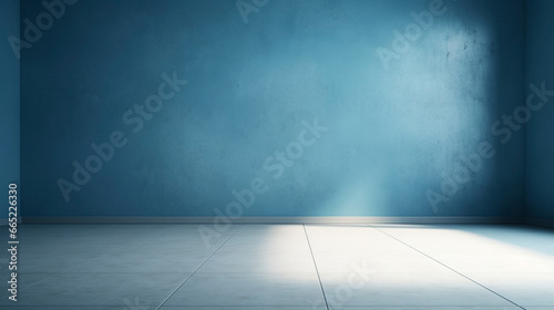 Interior of a blue pastel painted empty room, with soft warm light coming in from a window, abstract background with room for copy. 