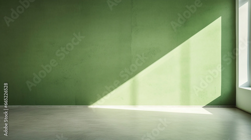 Interior mockup of a green pastel painted empty room, with soft warm light coming in from a window, abstract background with room for copy.  © @foxfotoco