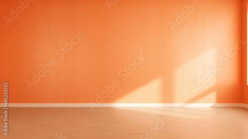 Interior mockup of an orange pastel painted empty room  with soft warm light coming in from a window  abstract background with room for copy. 