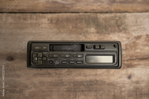 Vintage Car Cassette Radio on a Wooden Background