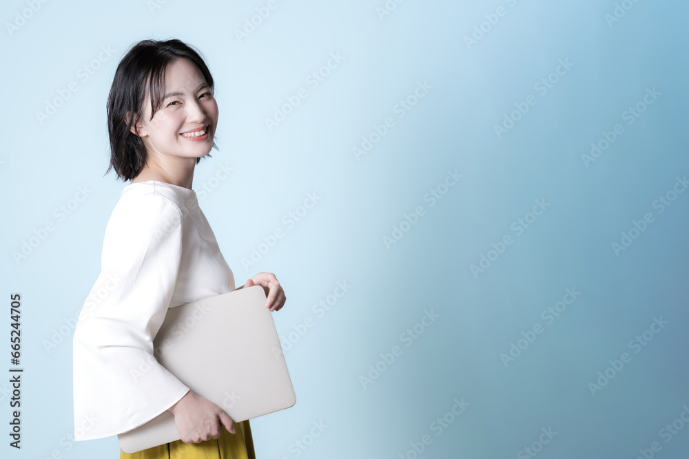 Woman with laptop computer for easy business use Fresh green background for job change and hiring image Woman with laptop computer for easy business use Fresh green background for job change and hiring image