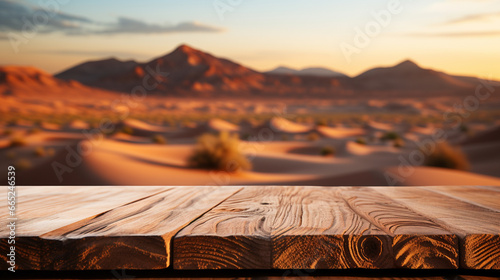 Wooden table top on blur desert background. For montage product display. View of copy space.  photo