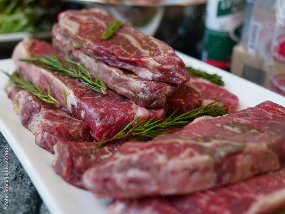 Close up uncooked premium beef steak with rosemary for christmas eve dinner family time celebration