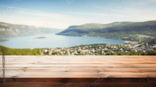 Empty wooden table top with blur background of mountain landscape