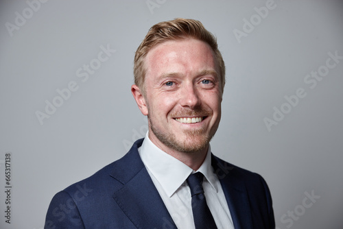 smiling middle aged man wearing suit and tie photo
