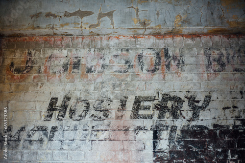 Ghost signage on brick wall photo