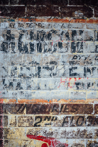 Ghost signage on brick wall photo