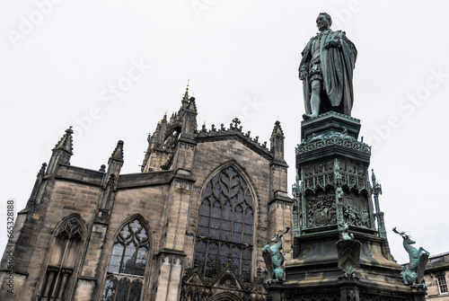 looking up at the John Knox Statue in Parliament Square, with St. Giles Cathedral in background photo