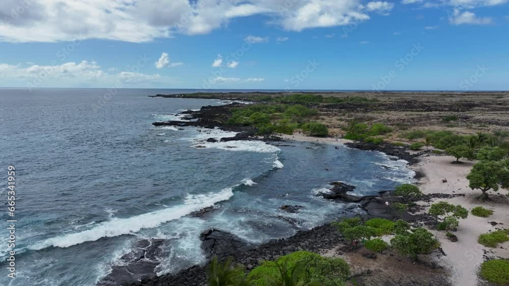 Aerial beautiful beach cove surf tropical seascape. Blue Pacific ocean water. Snorkel and scuba dive vacation destination. Black volcanic lava rock. Recreation and relaxation. Tropical landscape. Aerial beautiful beach cove surf tropical seascape. Blue Pacific ocean water. Snorkel and scuba dive vacation destination. Black volcanic lava rock. Recreation and relaxation. Tropical landscape.