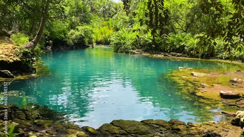 Turquoise water surrounded by tropical forest. Beto Lagoon in Barobo, Surigao del Sur. Philippines. photo
