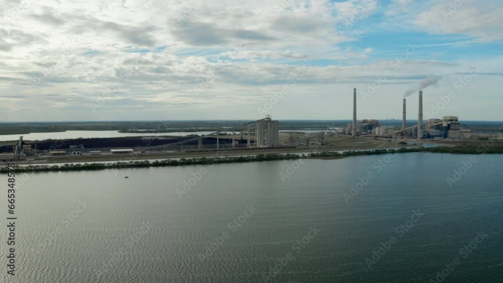 Power Plant with lake and boats - Drone shot track and orbit left v3 Power Plant with lake and boats - Drone shot track and orbit left v3