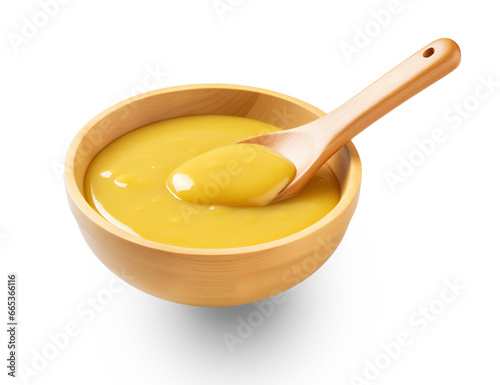 Wooden soup spoon and yellow mustard sauce in a wooden bowl,spicy sauce,Soy sauce, soybean sauce