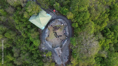 aerial view of students visiting Otanaha Fortress, Gorontalo-Indonesia. Otanaha Fortress
 photo