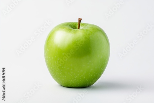 Photo of a fresh and appetizing green apple on a white minimalistic background. Delicious and healthy fruit.