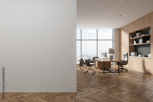 Stylish ceo interior with pc computer, armchairs and window. Mock up wall