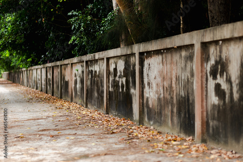 A street without people,a lonely narrow street with an asphalt alley.Long road