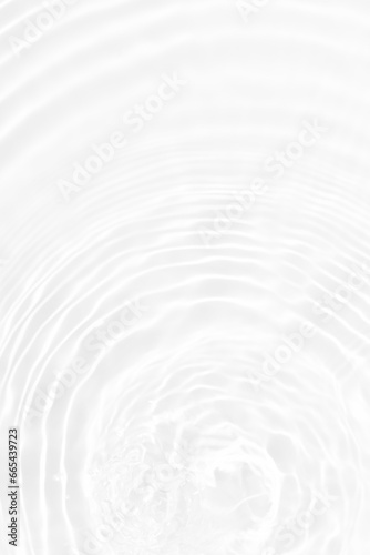 Defocus blurred transparent white colored clear calm water surface texture with splashes reflection. Trendy abstract nature background. Water waves in sunlight with copy space. Blue watercolor shine. photo