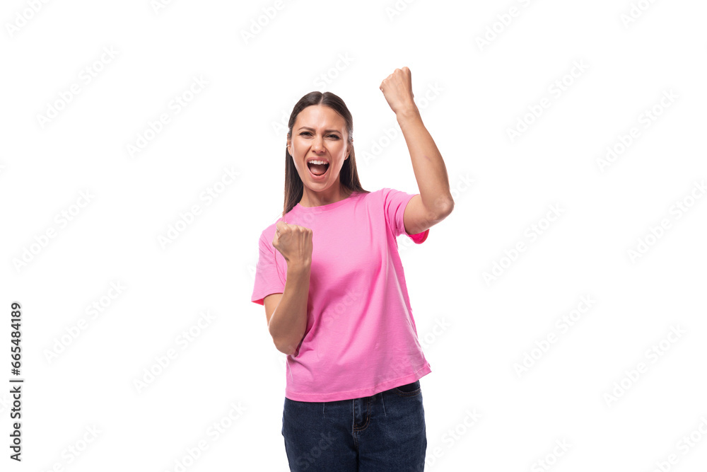 young charismatic good-looking woman with black hair wearing a pink t-shirt is experiencing joy and pleasure