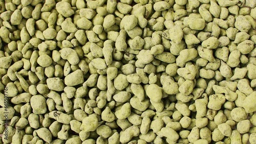 Ginseng Oolong Tea bunch, LAN GUI REN Classic green Chinese tea. Chinese oolong tea drink rolled in ginseng powder used for weight loss. Wulong Tea Granulars. Pouring. Falling. Background.